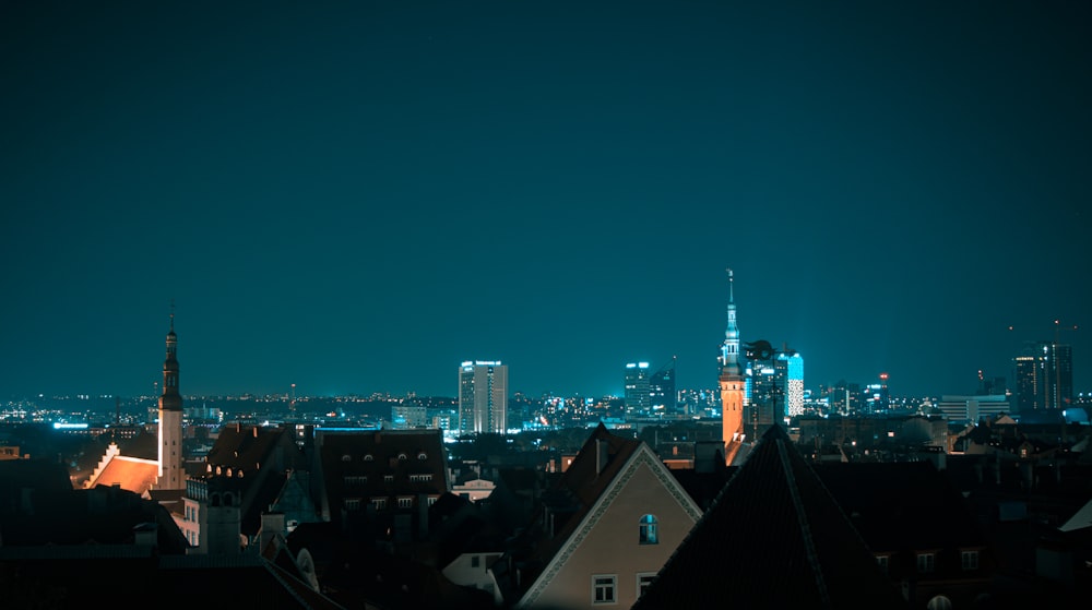 a view of a city at night from a rooftop