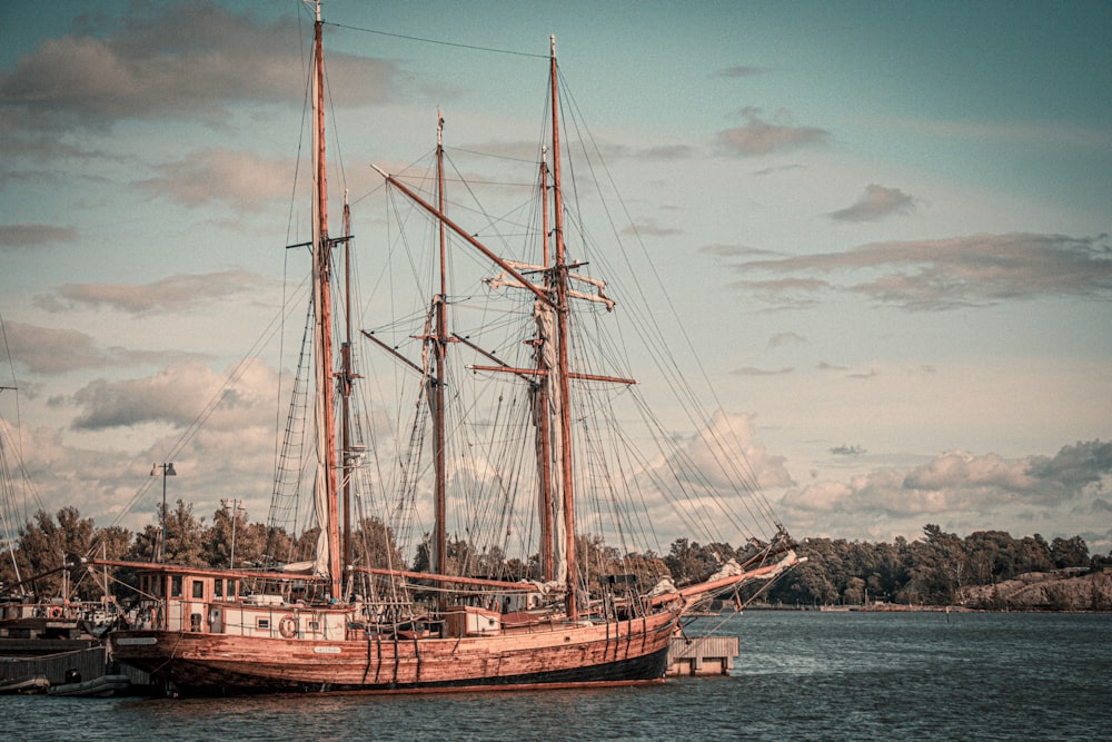 a large boat floating on top of a body of water