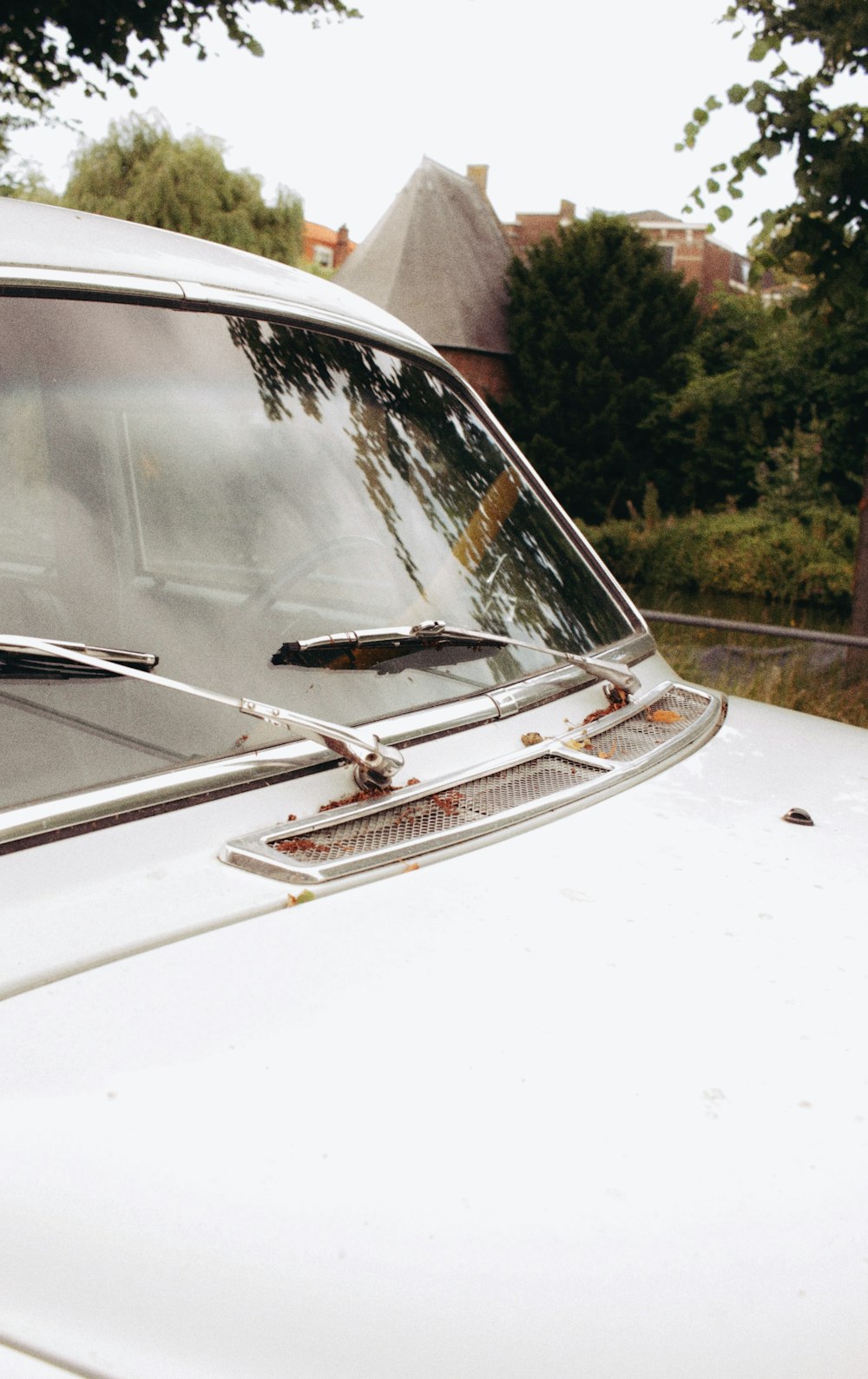 a close up of the front of a white car