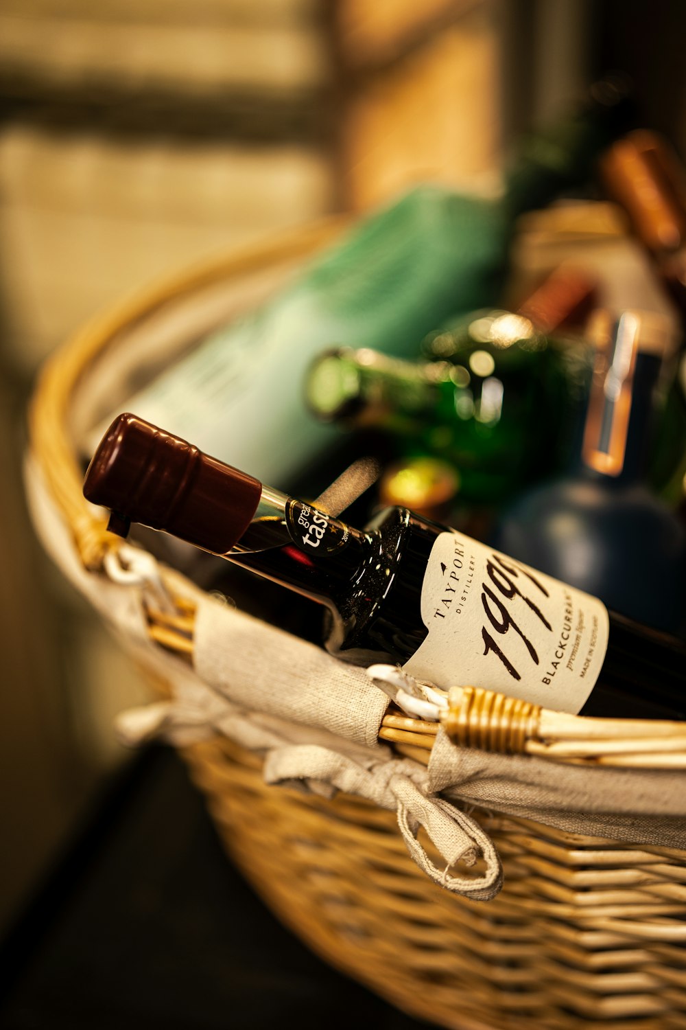 a wicker basket filled with bottles of wine
