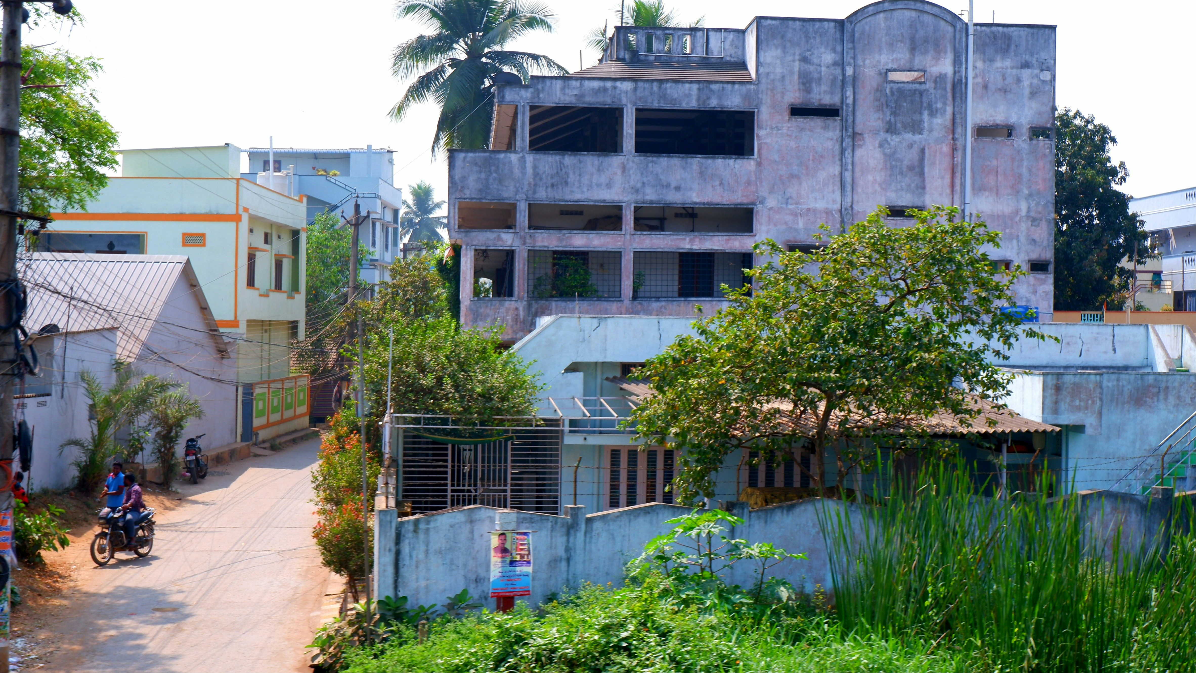 a group of people riding motorcycles down a street