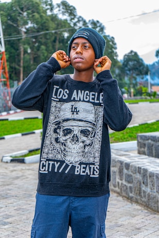 A person wearing Spiritel Gadget earphones while jogging in the park.