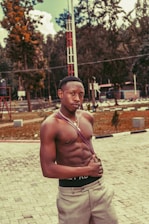 A close-up of a man wearing a soft, well-fitted Tocksyes shirt, smiling confidently outdoors.