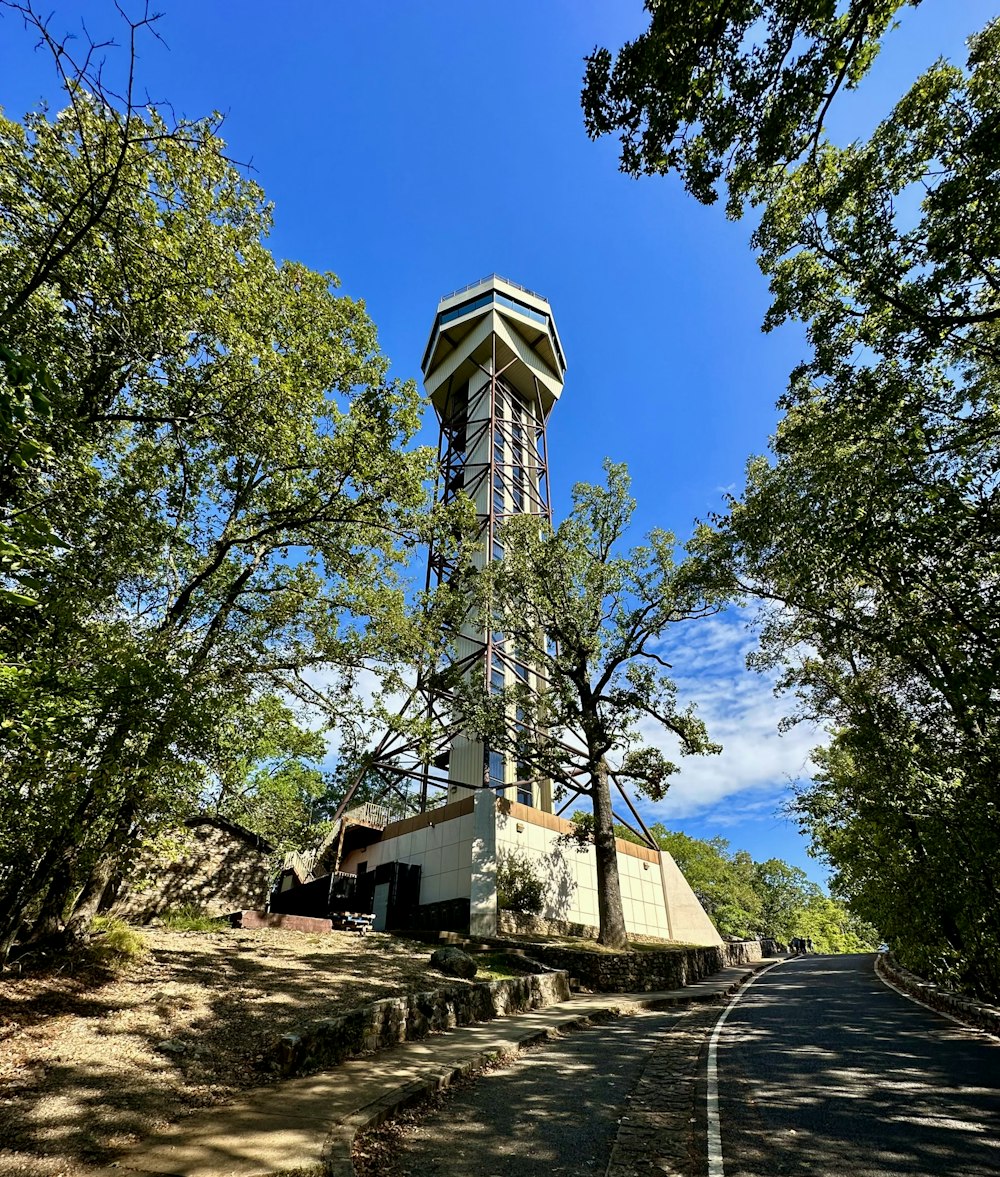 a tall tower with a clock on the top of it