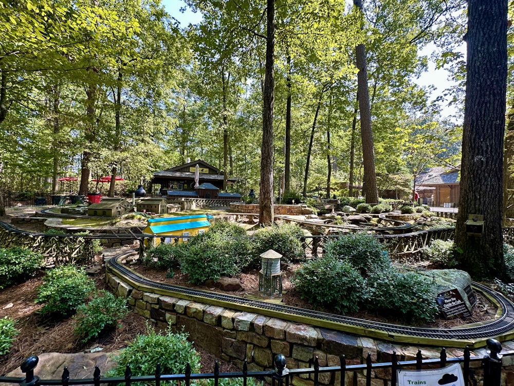 a train track in the middle of a wooded area