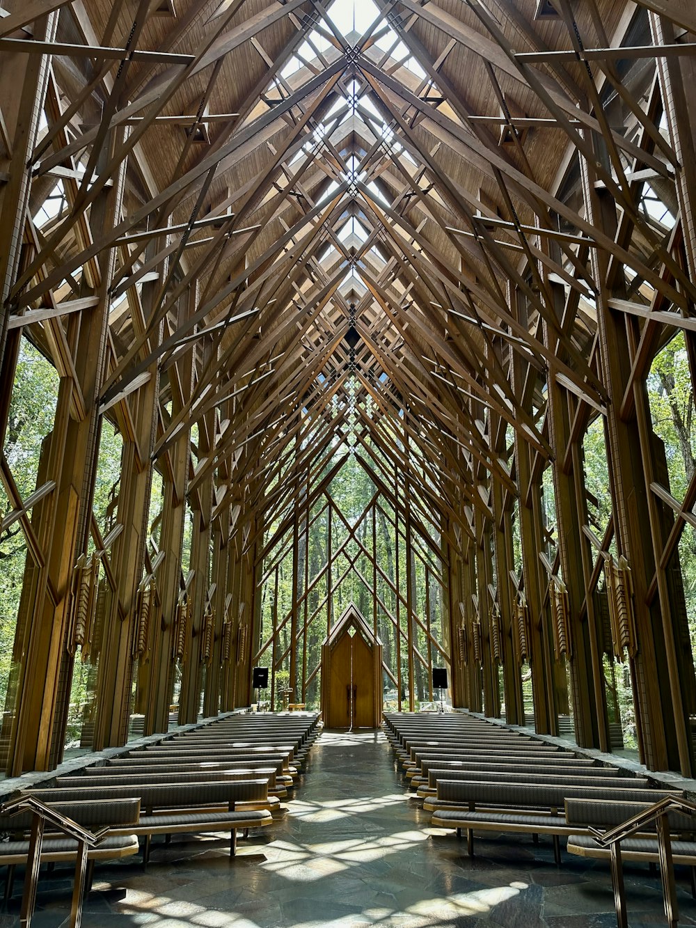 a church with a wooden roof and pews
