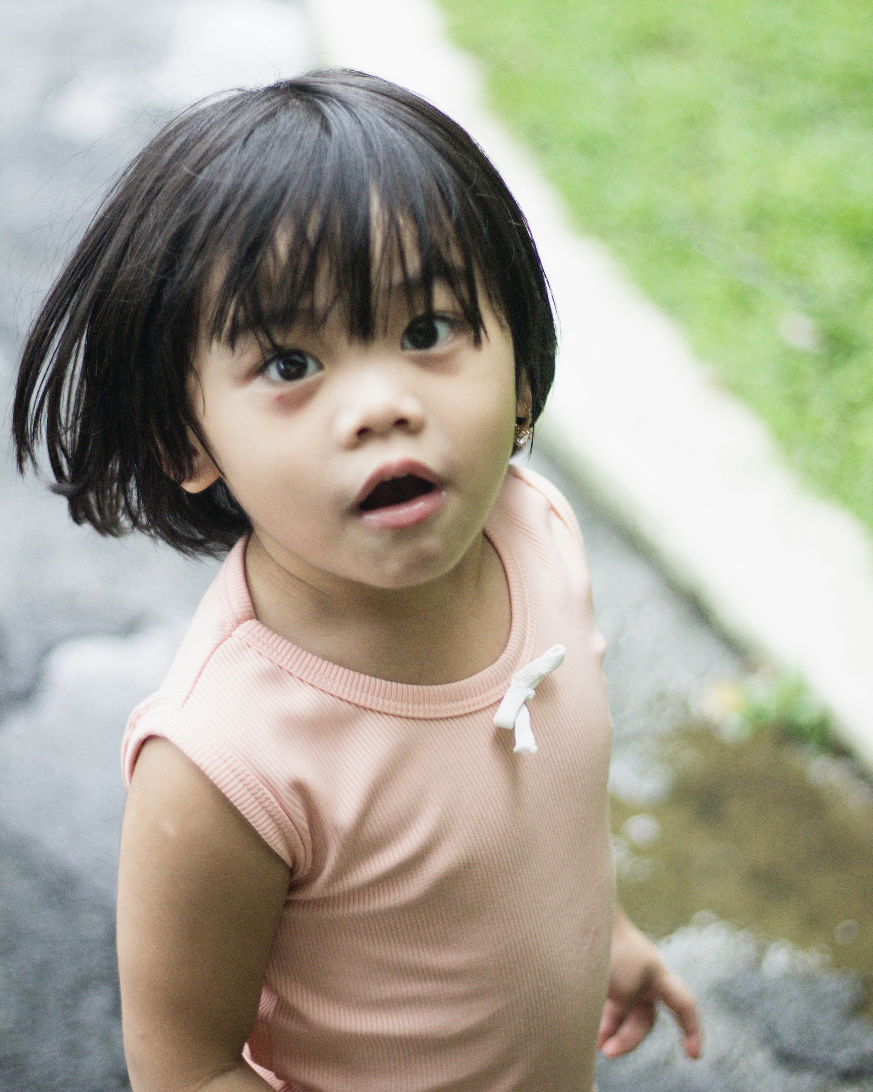 a little girl with a surprised look on her face