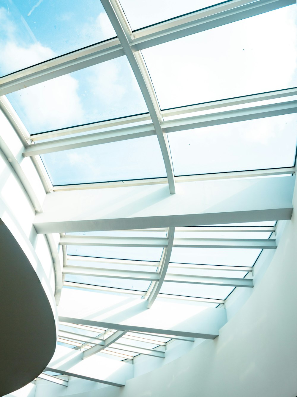 a view of the sky through a glass roof