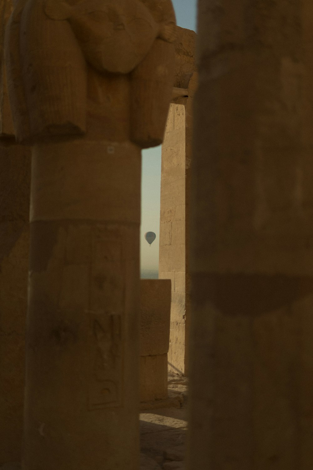 a couple of large stone pillars next to each other