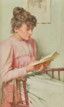 A woman in a pink dress reads a book