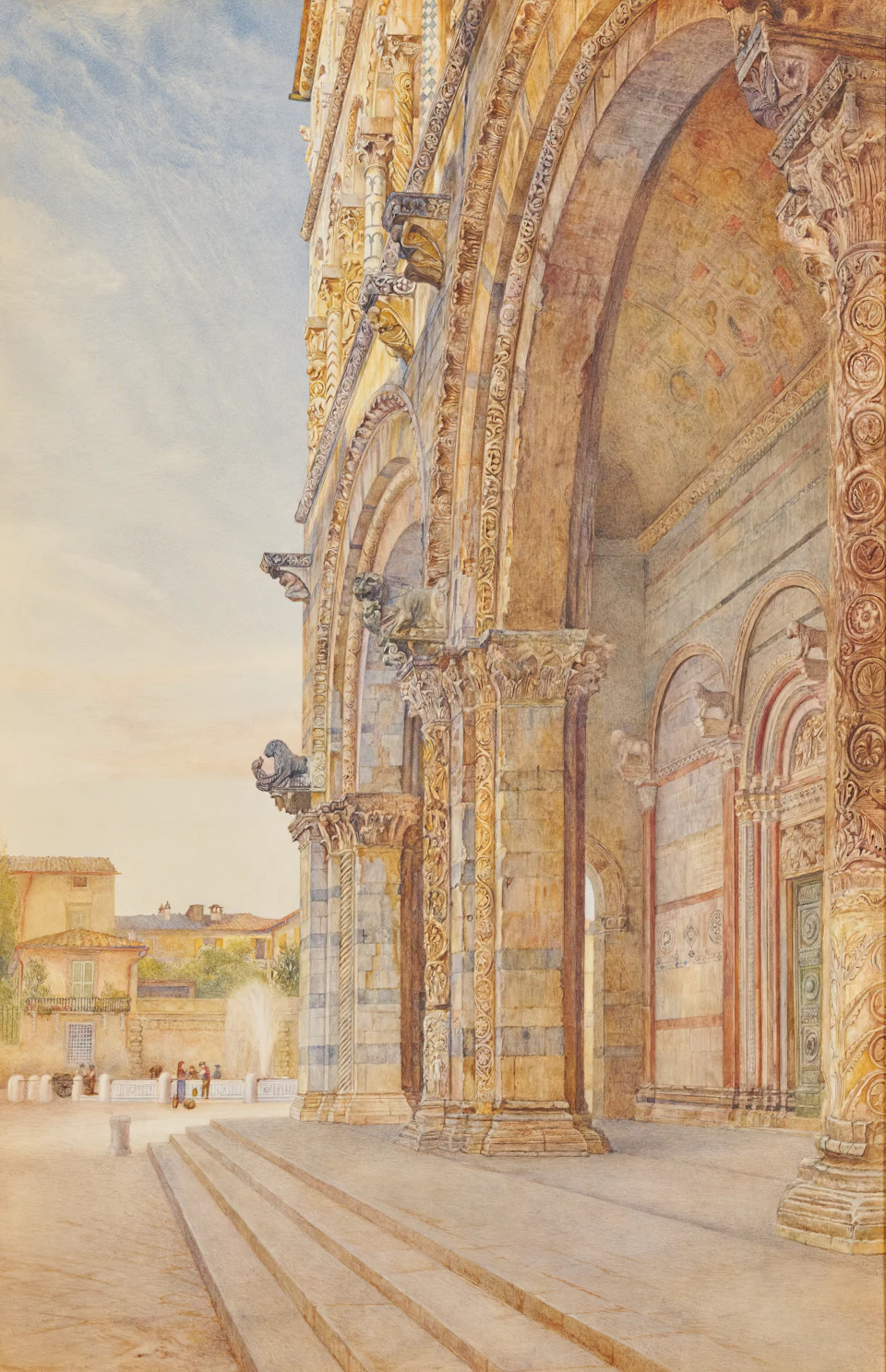 Large ornate building features two prominent columns and arches on either side staircase