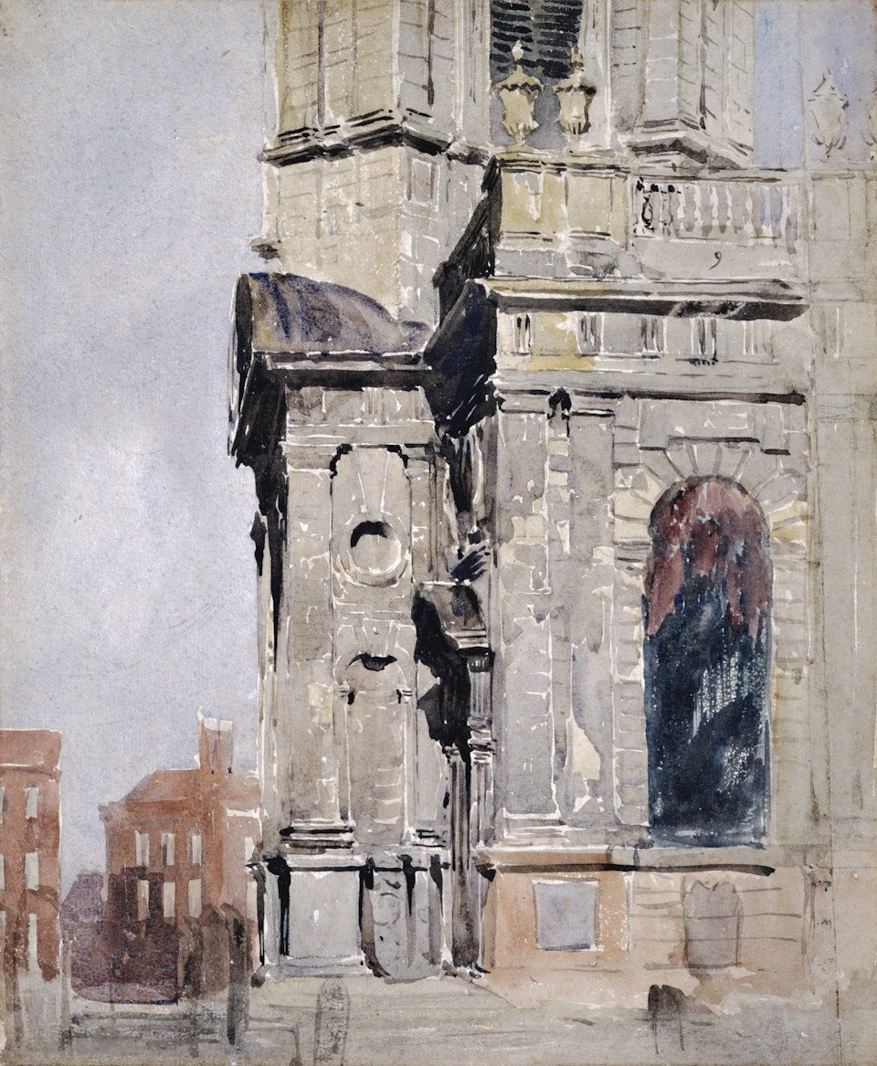 Large stone building with prominent dome and multiple windows at street corner