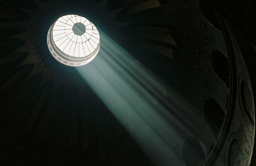 Sunlight streaming through a spotless veranda glass roof.