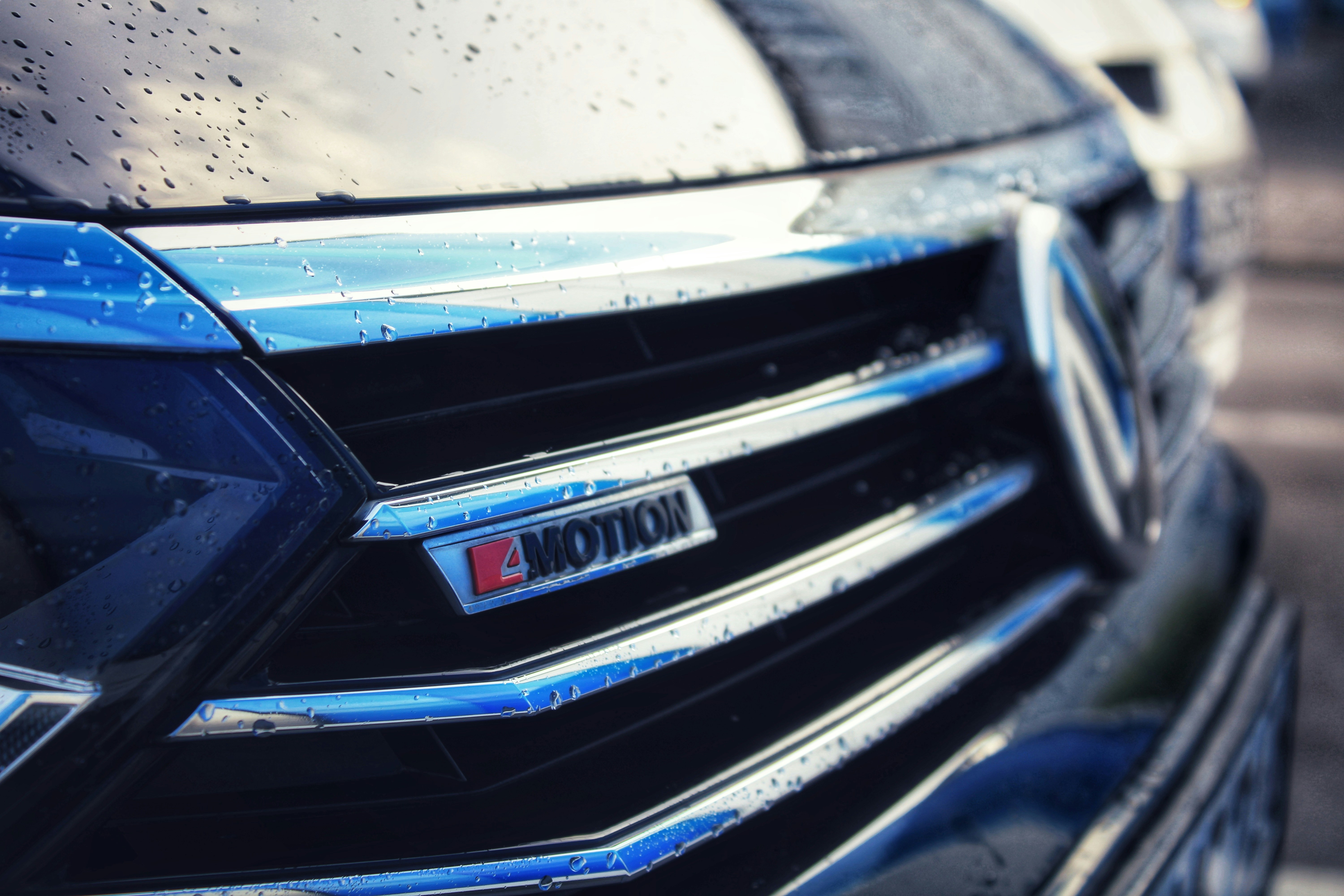 Close-up of a car's "motion" badge on grille.