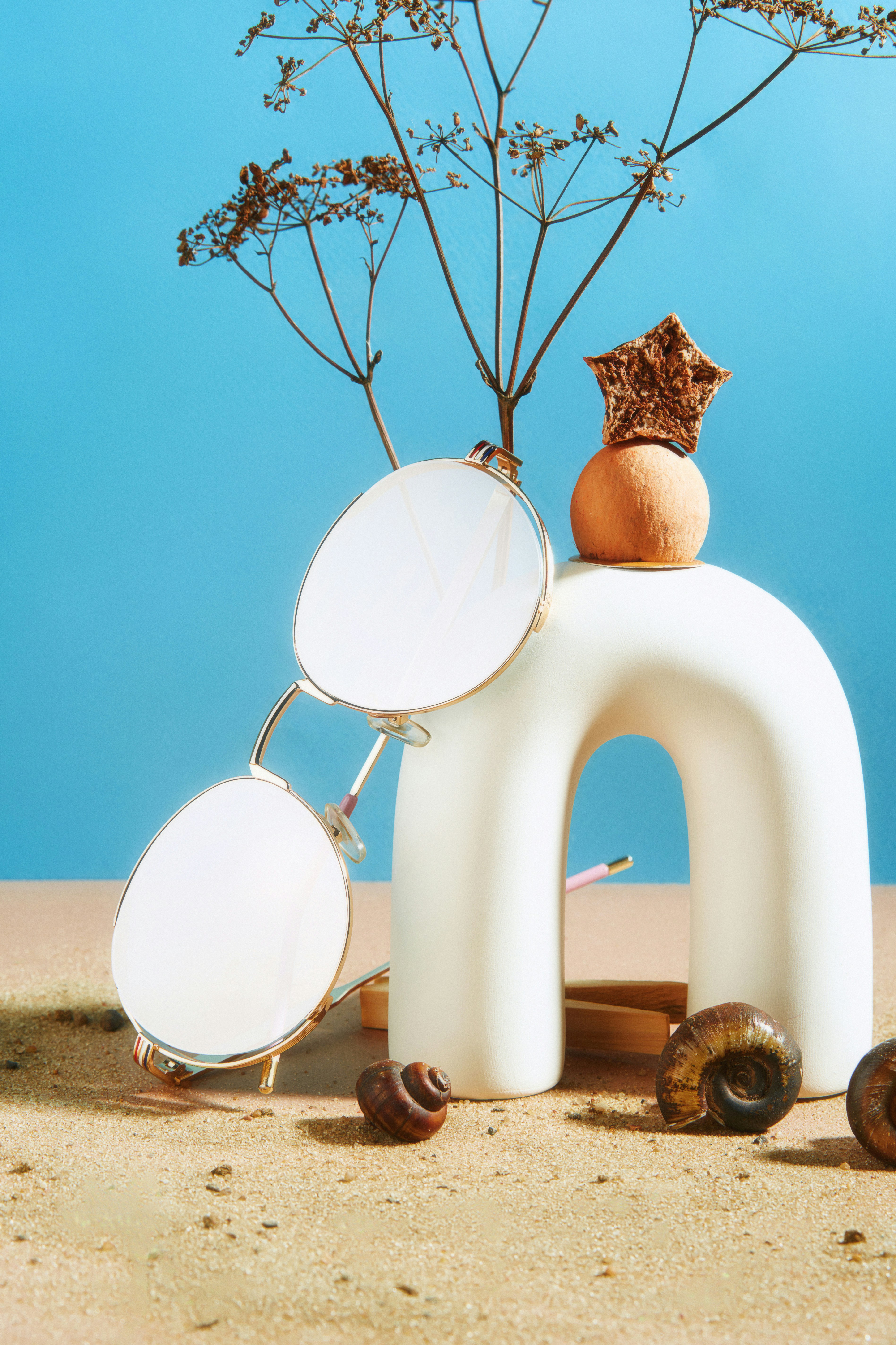 a pair of glasses sitting on top of a white object