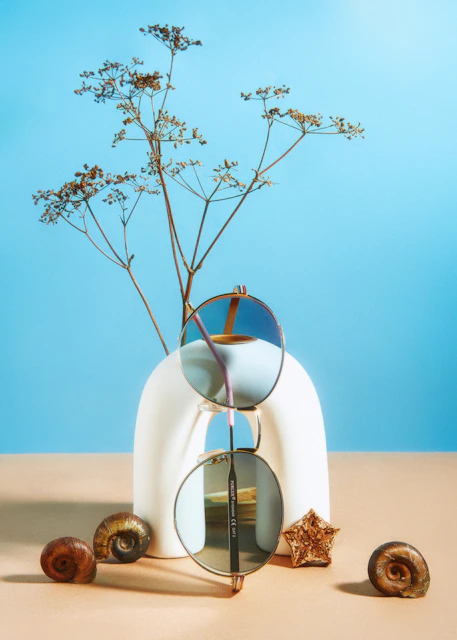 a vase with a plant in it sitting on a table