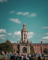 a group of people standing in front of a clock tower