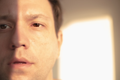 Portrait of a man in natural outdoor light with soft shadows.