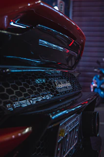 Sleek Lamborghini silhouette illuminated by smooth golden reflections on a dark background