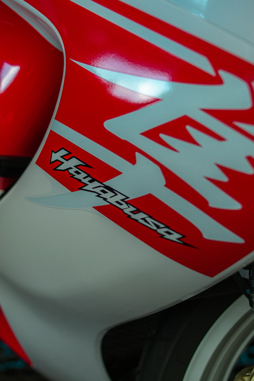 a close up of a red and white motorcycle