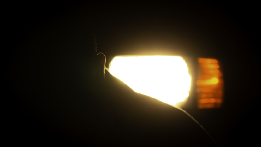 a close up of a street light in the dark