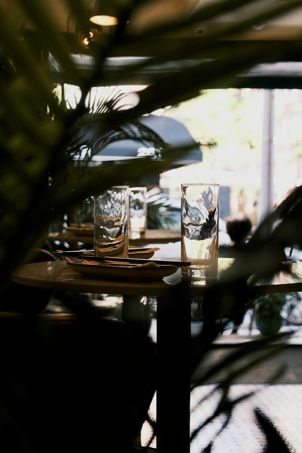 a table with two glasses and a plate on it