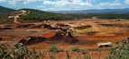 A panoramic view of a mining site in the Congo with heavy machinery at work.