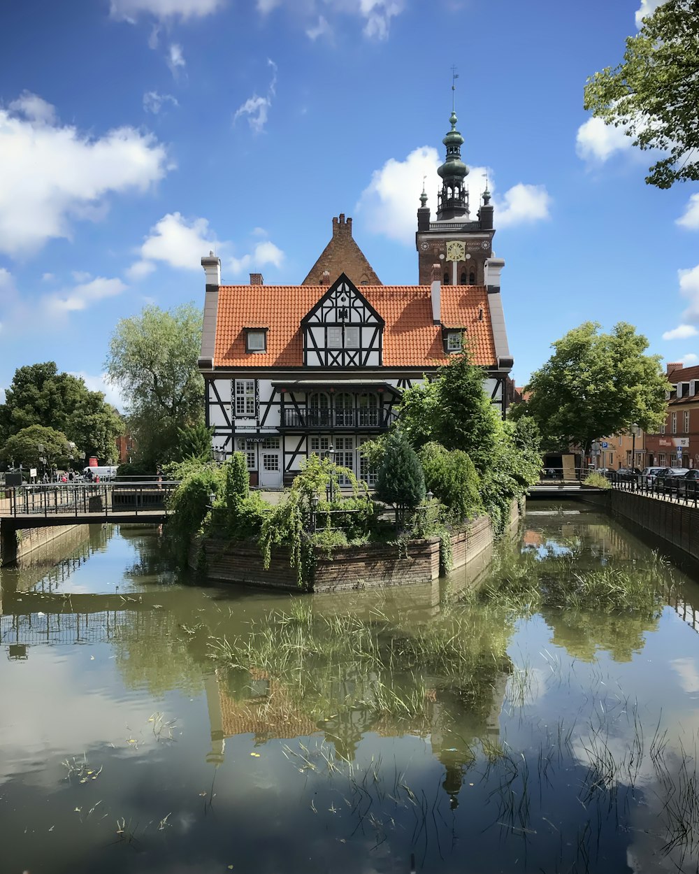 a house on a small island in the middle of a river