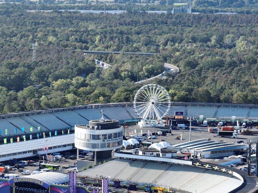 an aerial view of an airport with a ferris wheel