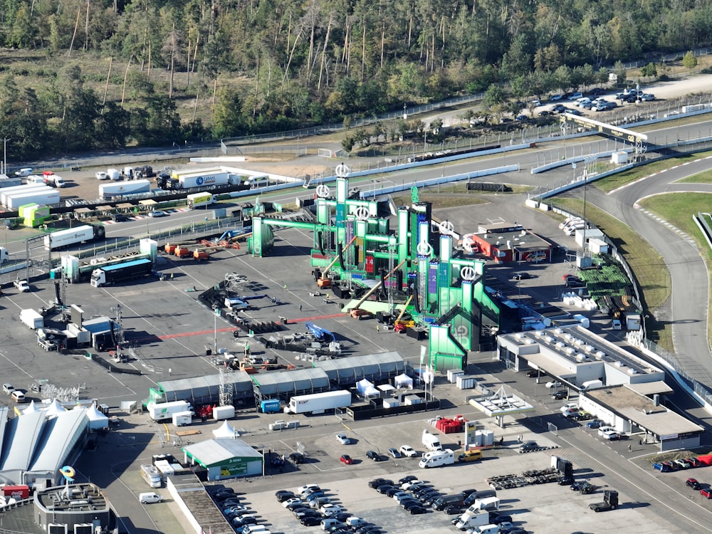 an aerial view of a parking lot with many vehicles