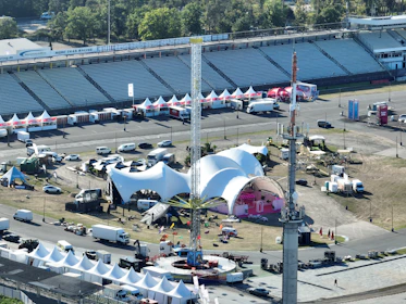 an aerial view of a carnival with tents and tents