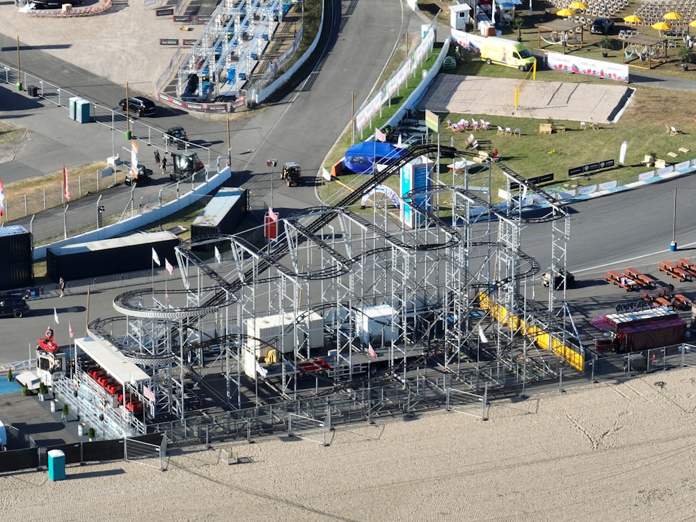 an aerial view of a roller coaster at a theme park