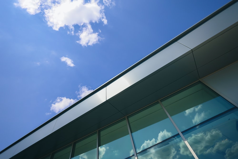 a building with a sky background and some clouds