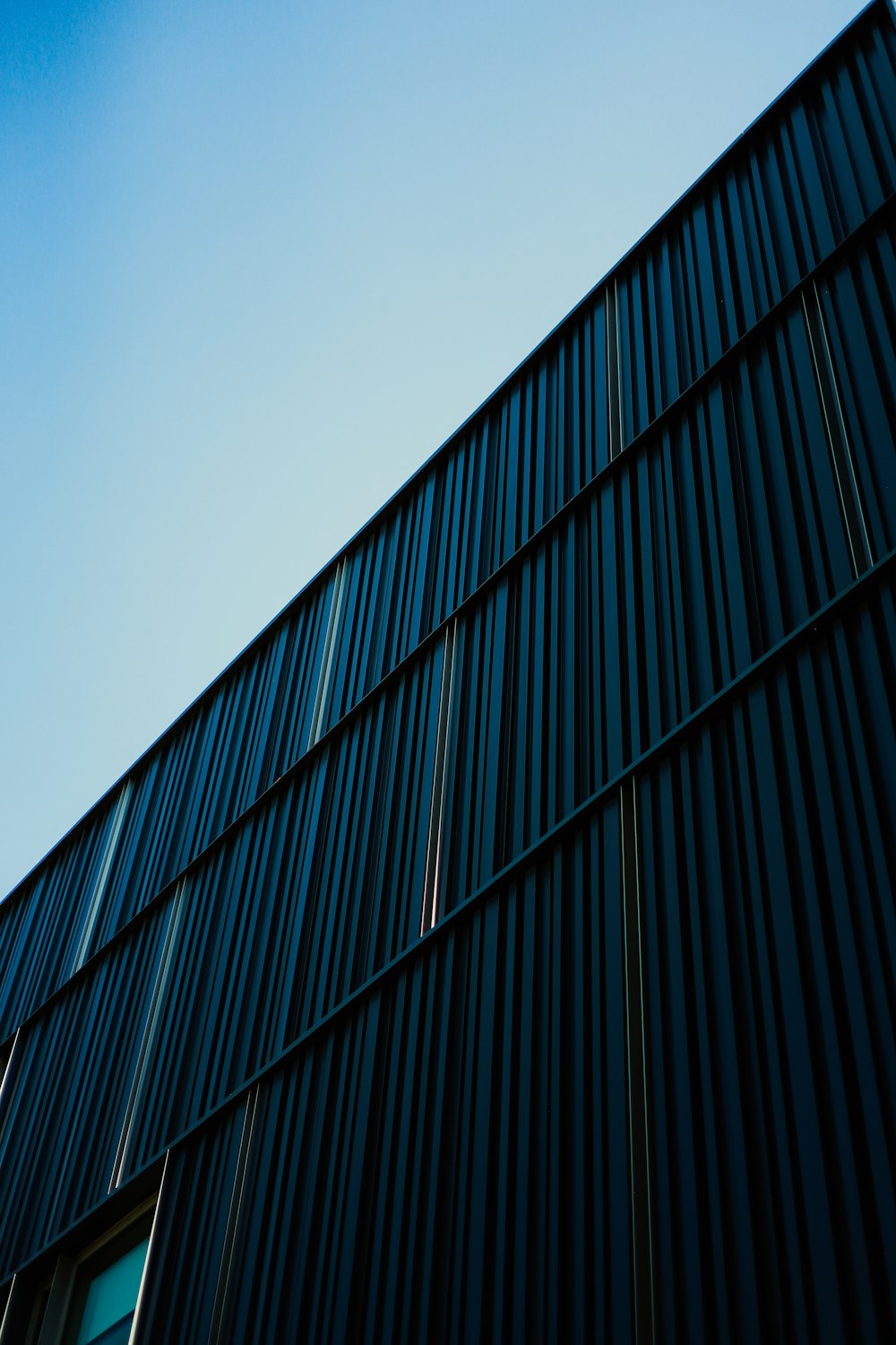 a close up of a building with a blue sky in the background