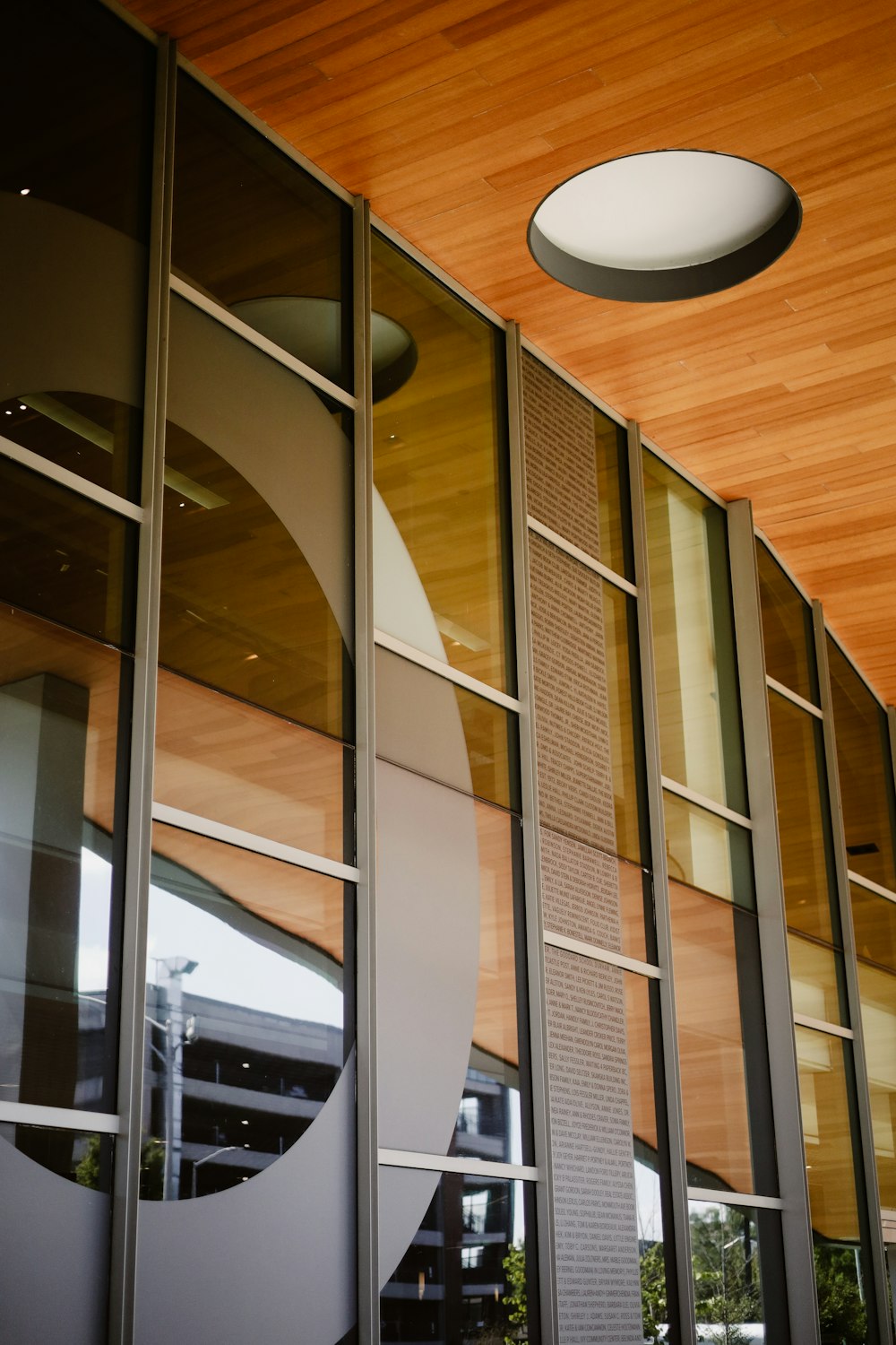 a building with a circular light hanging from the ceiling