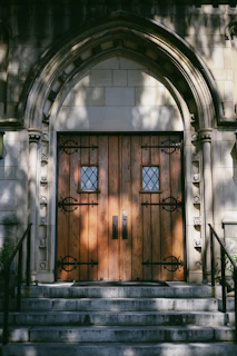 Detailed shot of decorative hinges and handles on a forged door