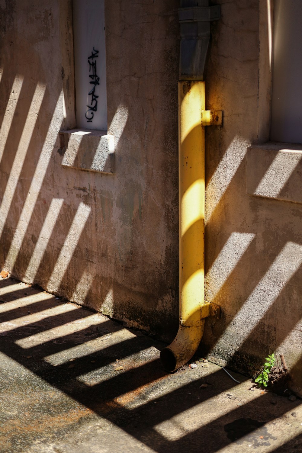 the shadow of a building on the ground