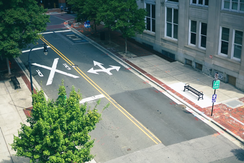 an aerial view of a city street with airplanes painted on it