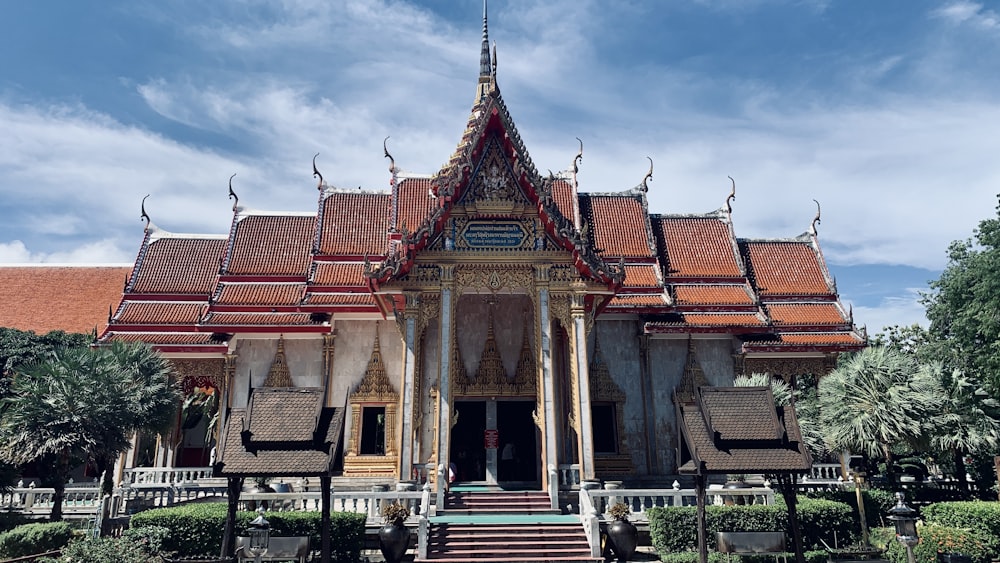 a large building with a lot of windows and a red roof