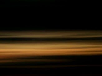 Abstract patterns of static and stripes overlaying a murky, muddy brown background.