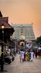 Ancient temples and bustling street life in Hanoi’s Old Quarter at sunset.