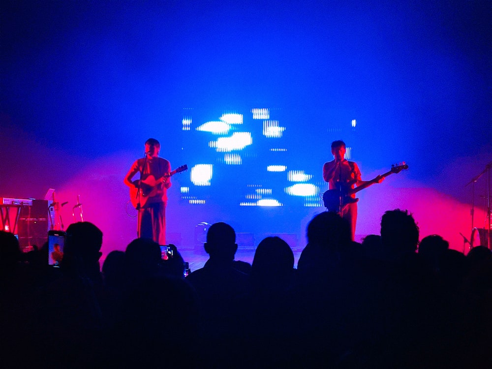 a group of people standing on top of a stage