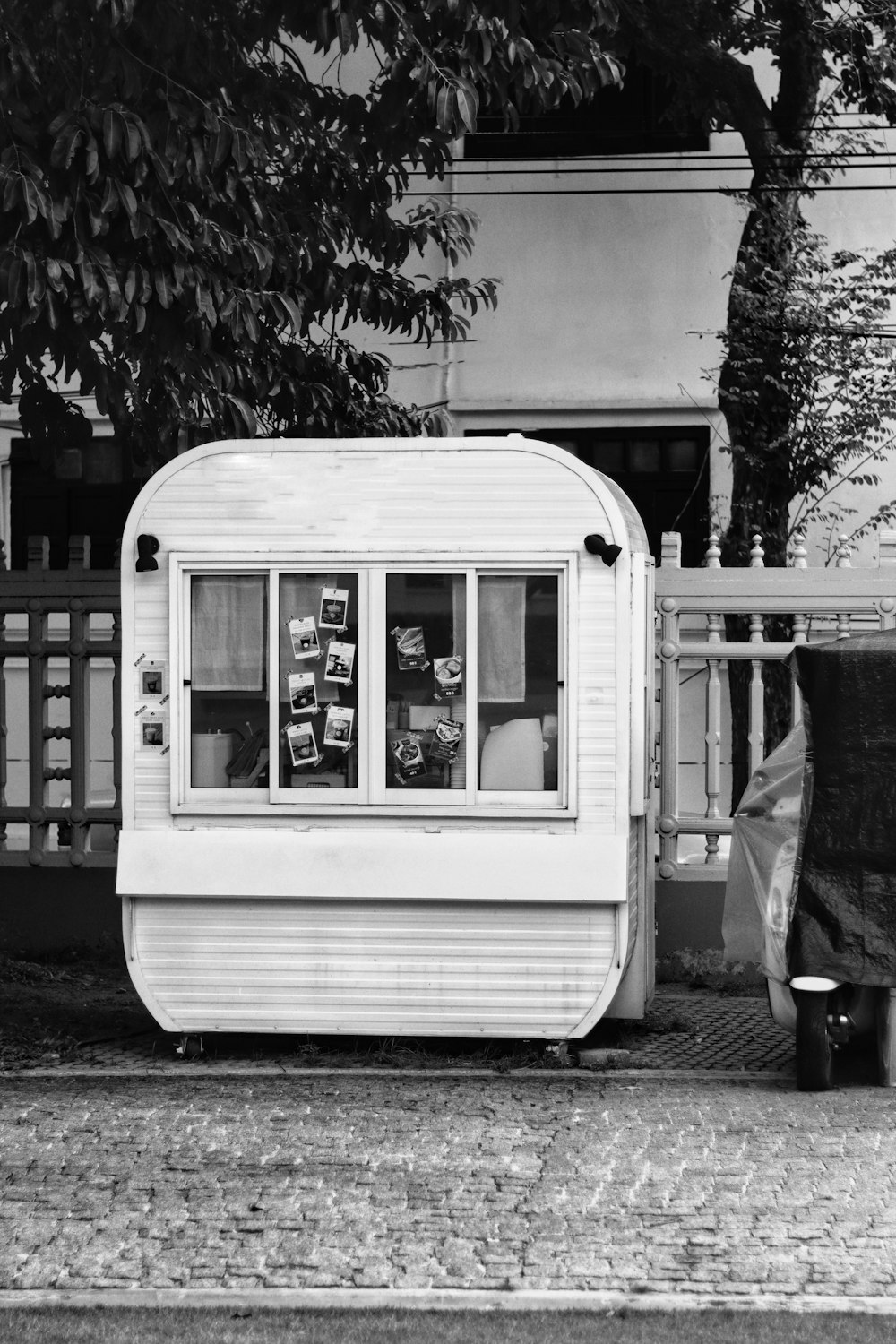 a black and white photo of a mobile home