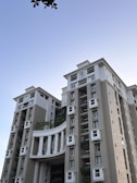 Modern urban residential buildings with clean lines and green spaces.