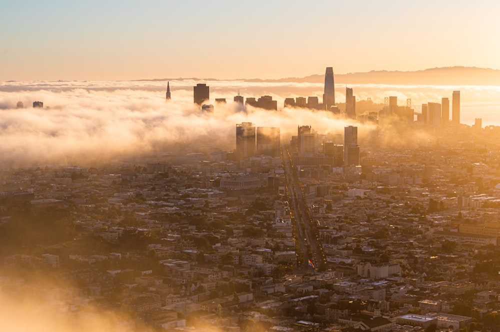 a view of a city in the middle of a foggy day