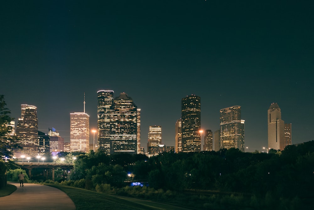 a night view of a city with tall buildings