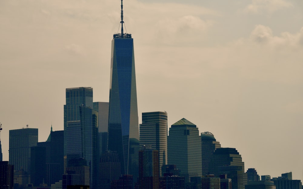 a very tall building towering over a city