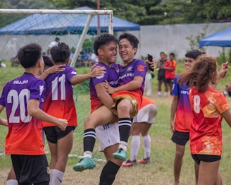 a group of young people playing a game of soccer