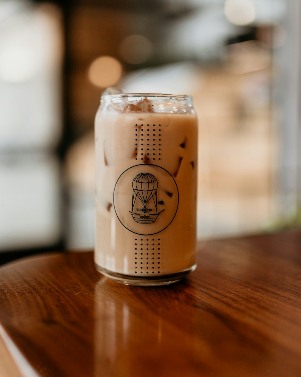 a drink sitting on top of a wooden table