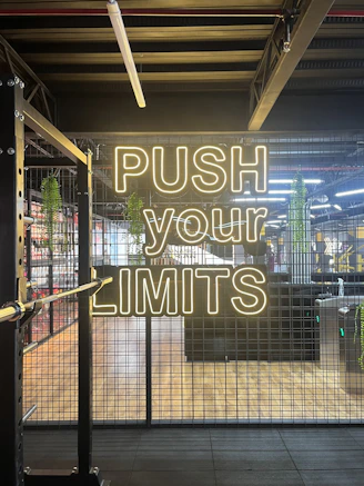 a neon sign that reads push your limits